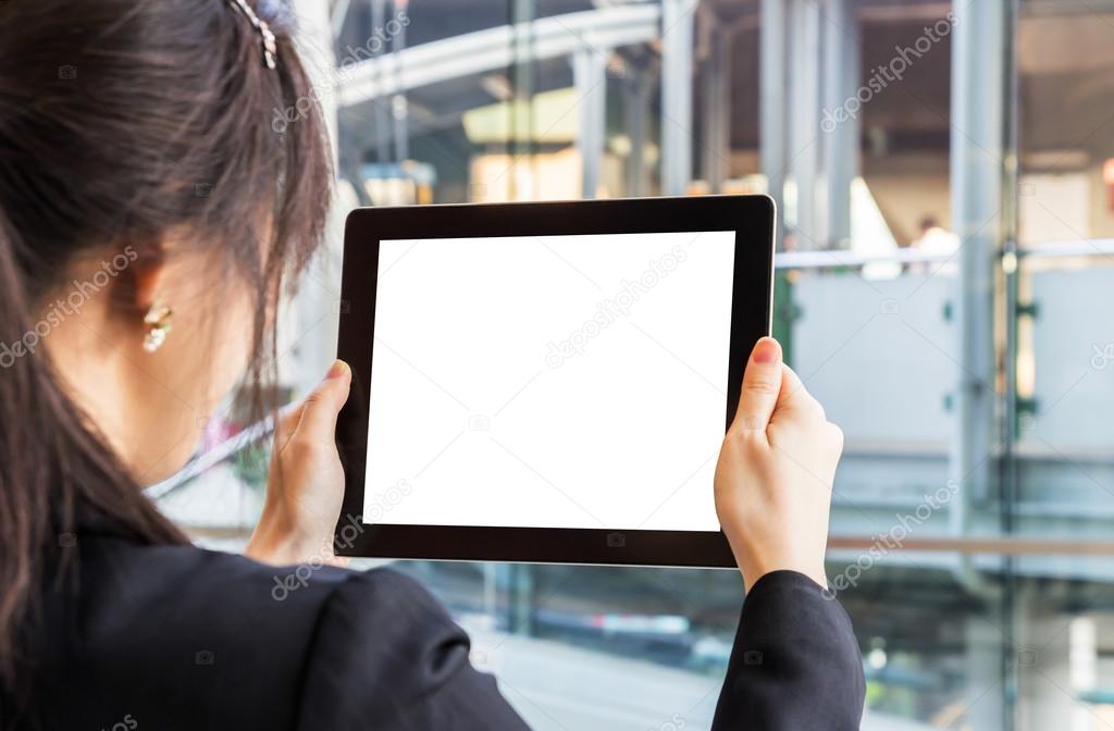 Businesswoman looking digital tablet. Space for your picture.