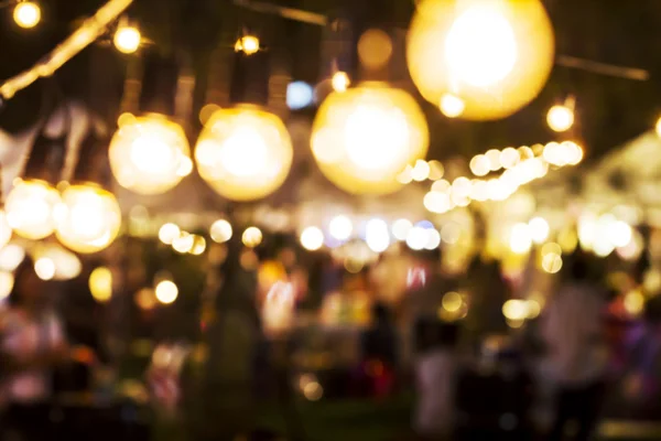 Luces borrosas abstractas del mercado nocturno — Foto de Stock