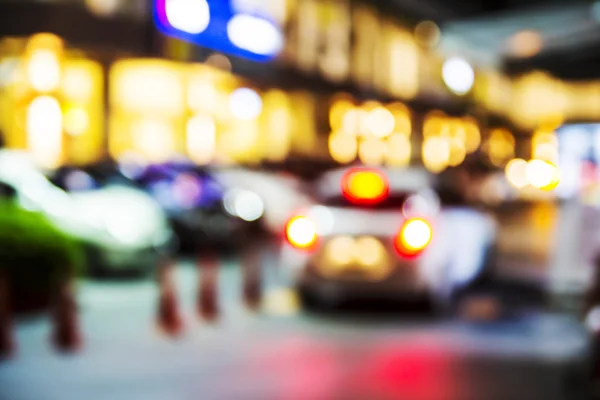 Abstrato luzes embaçadas do parque de estacionamento no shopping — Fotografia de Stock