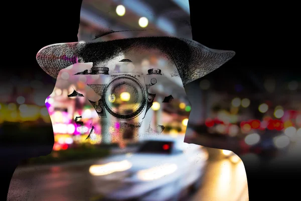 Double exposure of woman taking a photo night lights — Stock Photo, Image