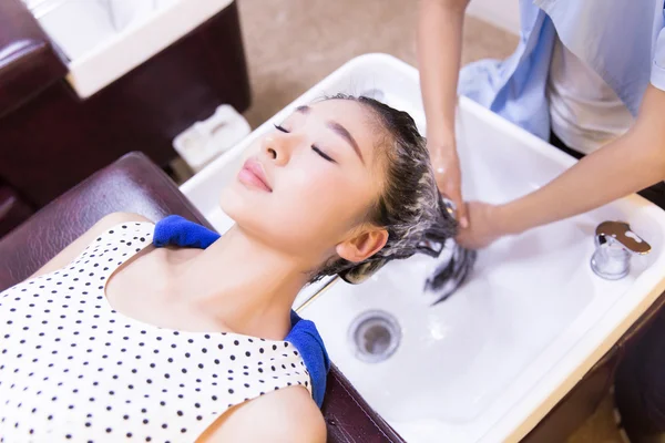 Girl with her hair in barber shop — Stock Photo, Image