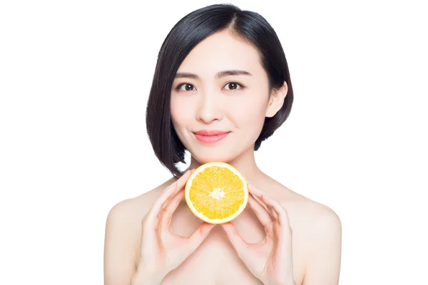Chinese woman with oranges in her hands — Stock Photo, Image