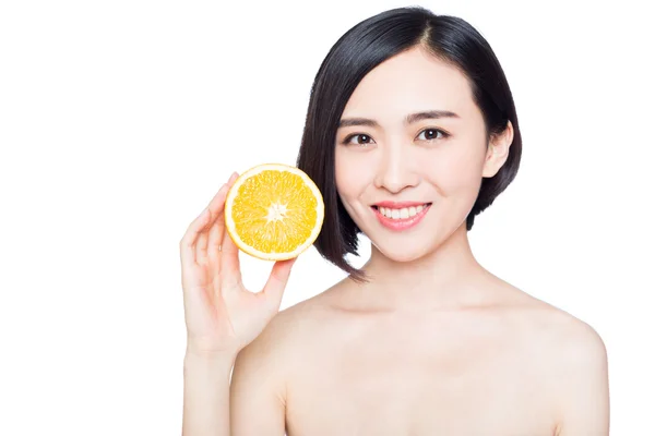 Chinese woman with oranges in her hands — Stock Photo, Image