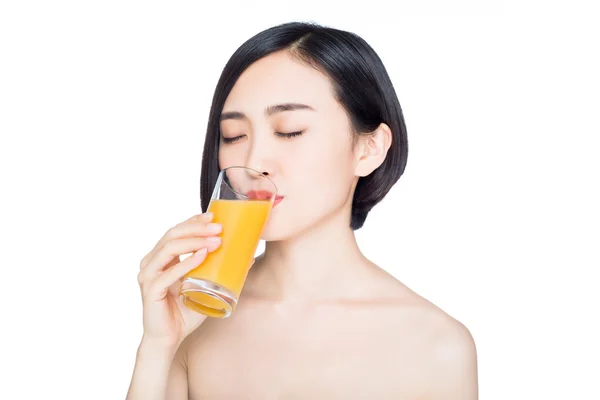 Young woman with orange juice — Stock Photo, Image