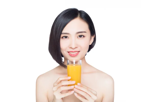 Mujer joven con jugo de naranja —  Fotos de Stock