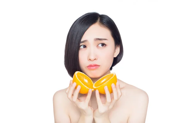 Chinese woman with oranges in her hands — Stock Photo, Image