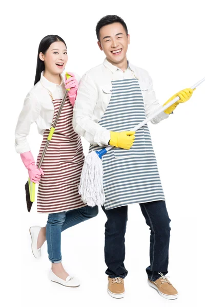 Man and woman holding cleaning supplies — Stock Photo, Image