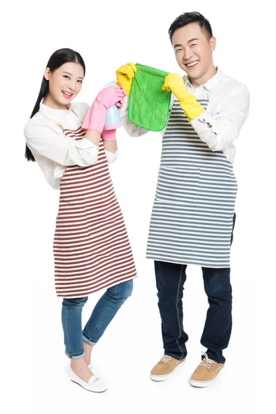 Man and woman holding cleaning supplies — Stock Photo, Image