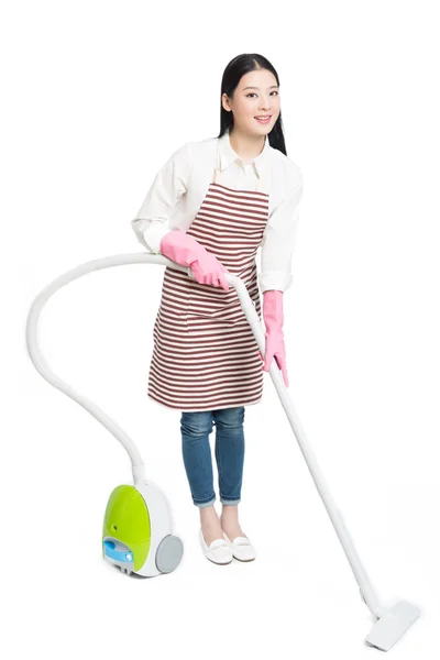 Chinese young woman with a vacuum cleaner — Stock Photo, Image