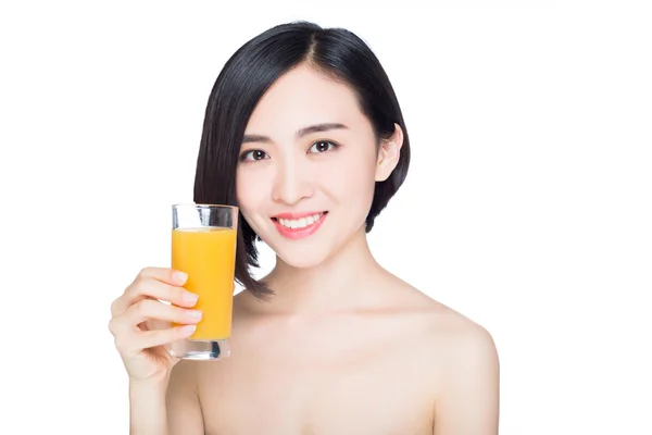 Chinese woman with orange juice — Stock Photo, Image