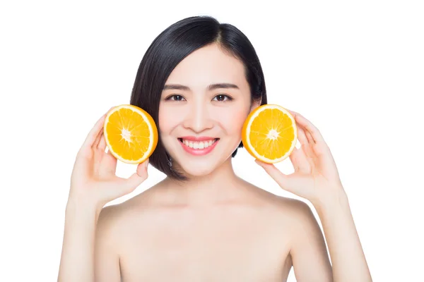 Chinese woman with oranges in her hands — Stock Photo, Image