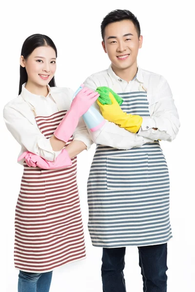 Man and woman holding cleaning supplies — Stock Photo, Image