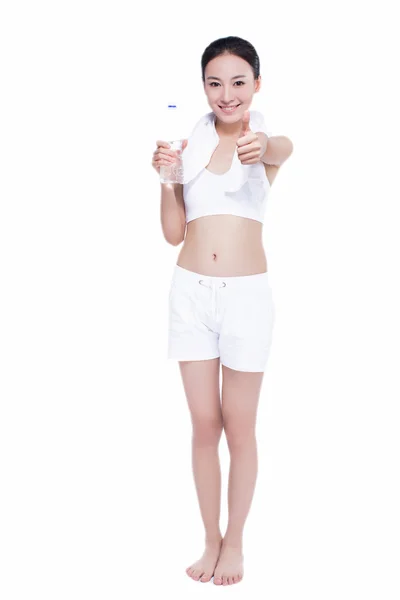 Healthy asian woman with towel and water bottle — Stock Photo, Image