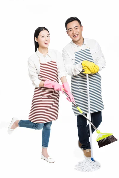Muž a žena držící čistící prostředky — Stock fotografie