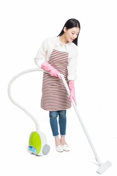 Chinese young woman with a vacuum cleaner — Stock Photo, Image