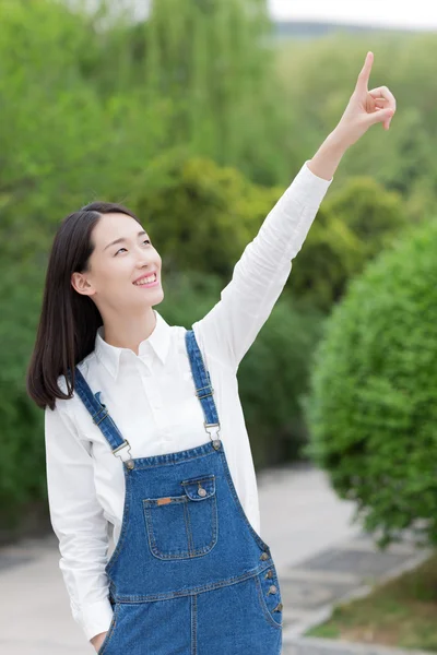 Girl stretched out her forefinger — Stok fotoğraf