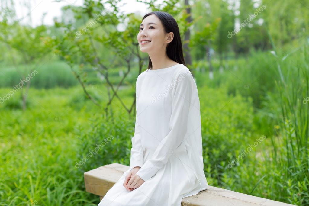 Chinese Girl Wearing a White Dress Stock Image - Image of field