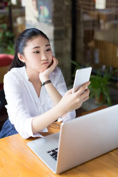 Lovely woman working with laptop at cafe — Stock Photo, Image