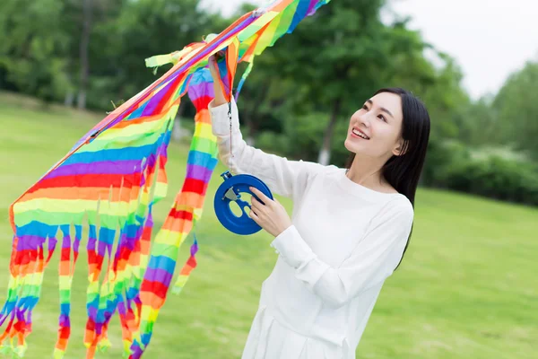 Girl holding a kite — Stock Photo, Image