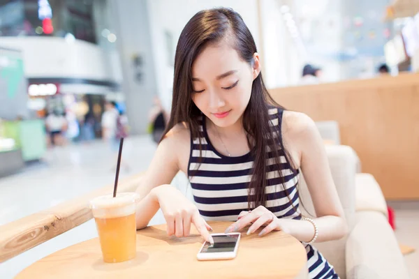 Girl drinking a glass of iced drinks — Stock Photo, Image