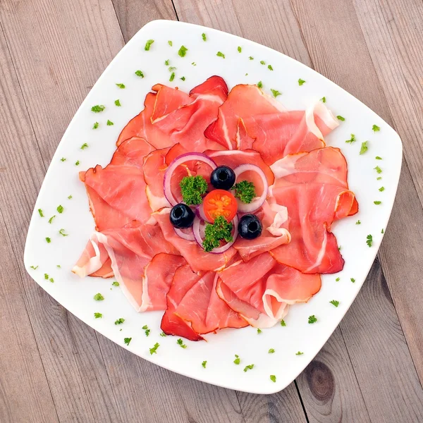 Sliced ham on plate. — Stock Photo, Image