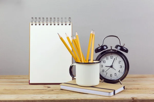 Pencils, alarm clock and notebook — Stock Photo, Image