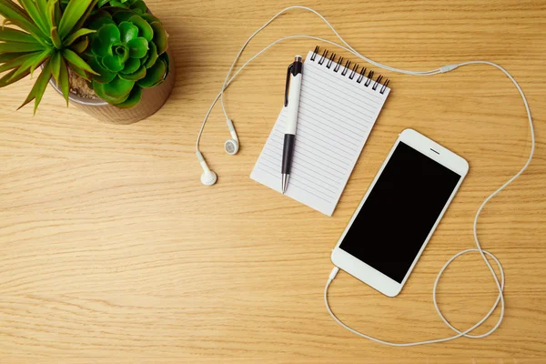 Office desk with smartphone — Stock Photo, Image