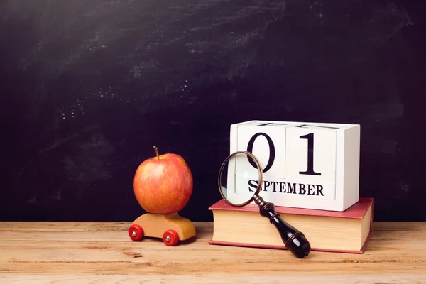 Book, toy car, apple and calendar — Stock Photo, Image