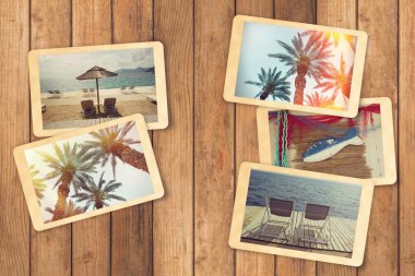 instant photos on wooden table clipart