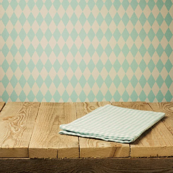 Wooden table with tablecloth — Stock Photo, Image