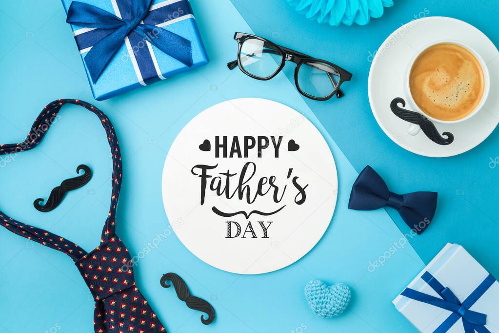 Happy Fathers day concept with coffee cup,  tie bow and gift box on blue background
