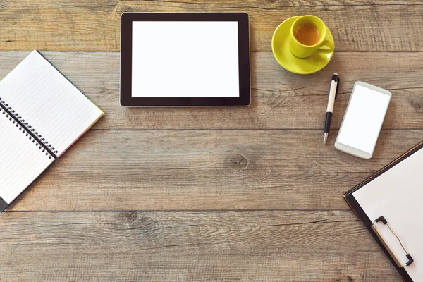 Office desk with tablet smartphone and coffee — Stock Photo, Image