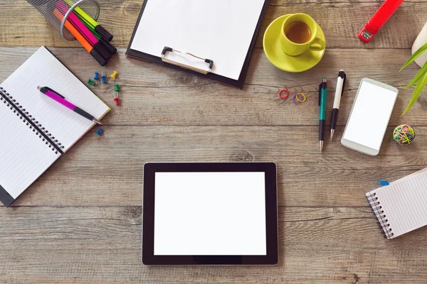 Office desk with tablet smartphone and coffee — Stock Photo, Image