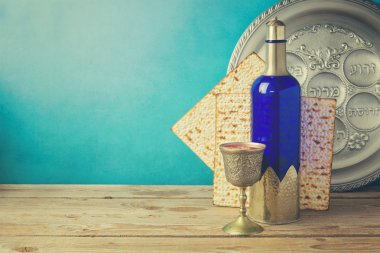 Matzo and wine on wooden vintage table clipart