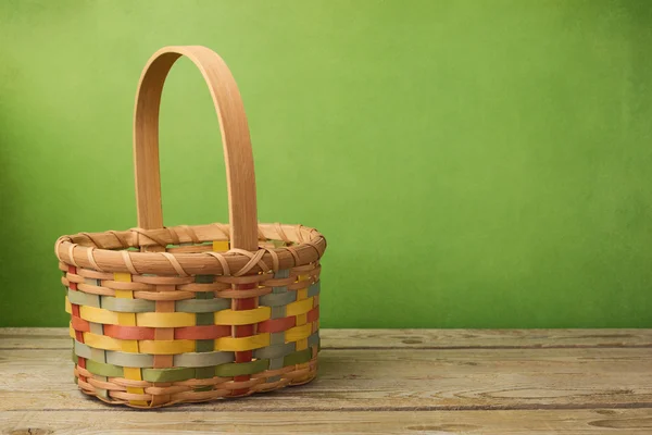 Empty basket on wooden table — Stock Photo, Image