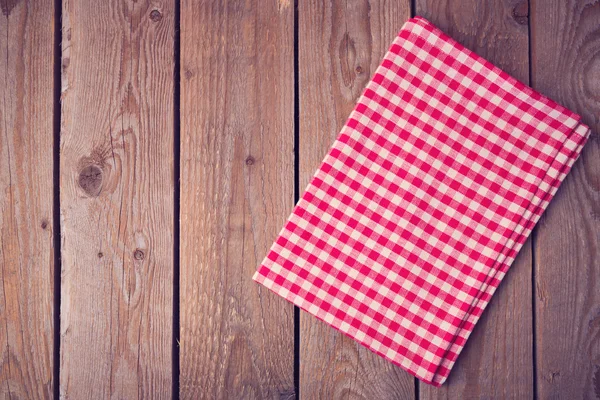 Tablecloth on wooden table — Stock Photo, Image