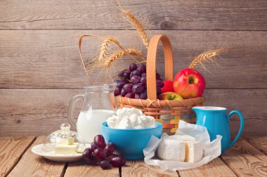 Milk, cheese and fruit basket clipart