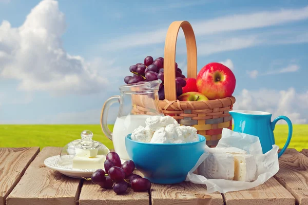 Milk, cottage cheese, butter and fruit — Stock Photo, Image