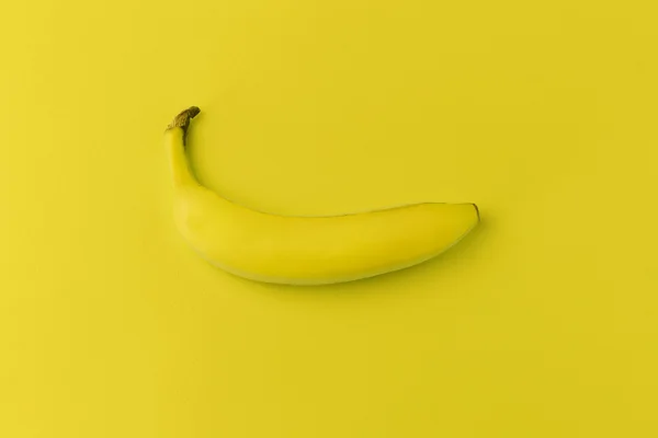 Banana on yellow background