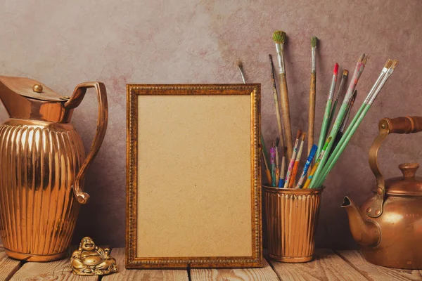 Poster frame with vintage artistic objects — Stock Photo, Image
