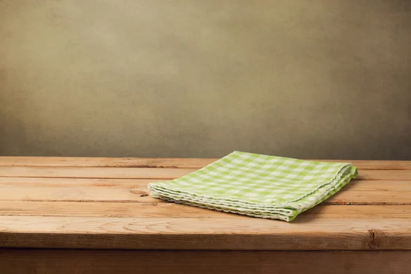 Table with checked green tablecloth — Stock Photo, Image