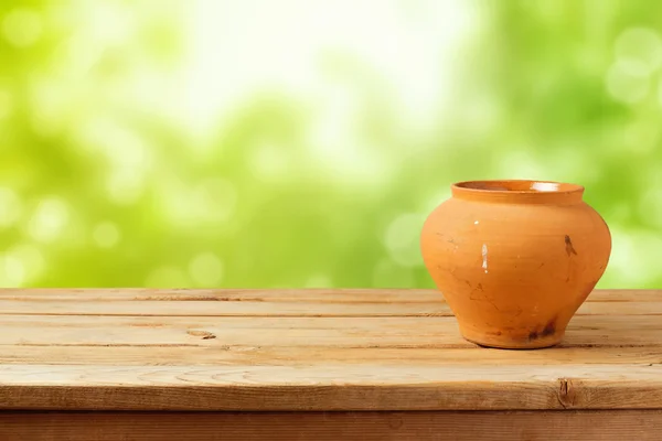 Ceramic pot on wooden table — Stock Photo, Image