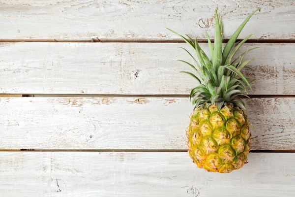 Pineapple on wooden board — Stock Photo, Image