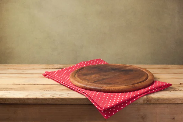 Round wooden board with tablecloth — Stock Image Round wooden board with tablecloth Stock Photo