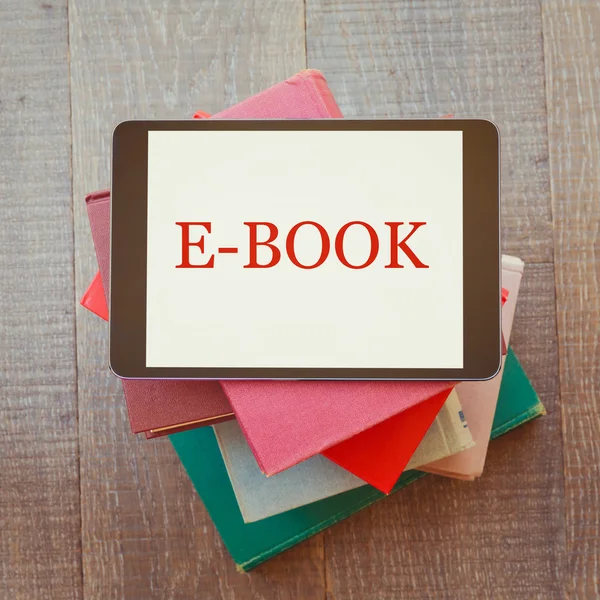 Digital tablet and books — Stock Photo, Image