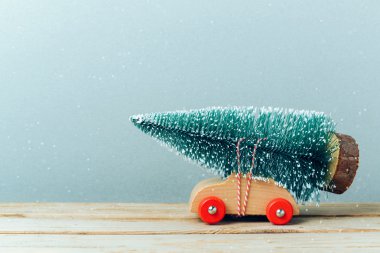Christmas tree on toy car clipart