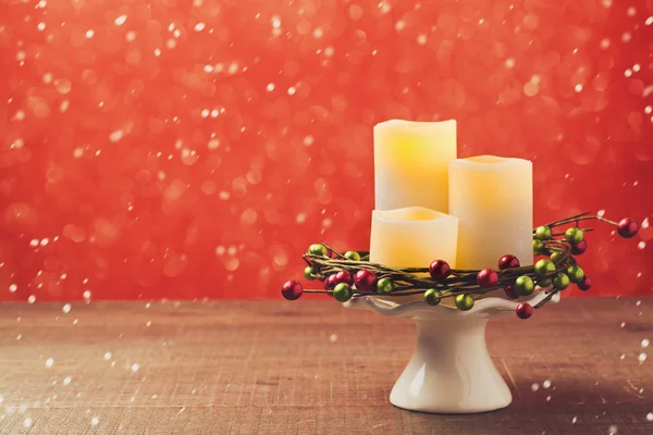 Dekorace svíčky přes červený — Stock fotografie