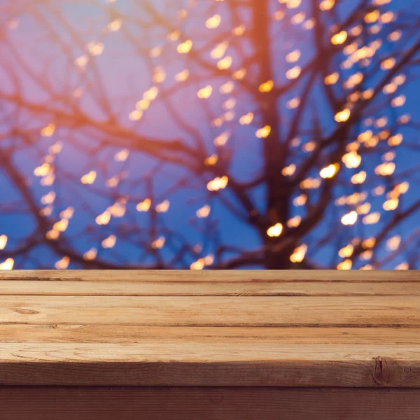 Wooden empty table over festive tree — Stock Photo, Image