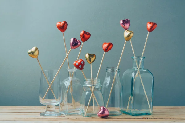 Chocolate candies in glass vases — Stock Photo, Image