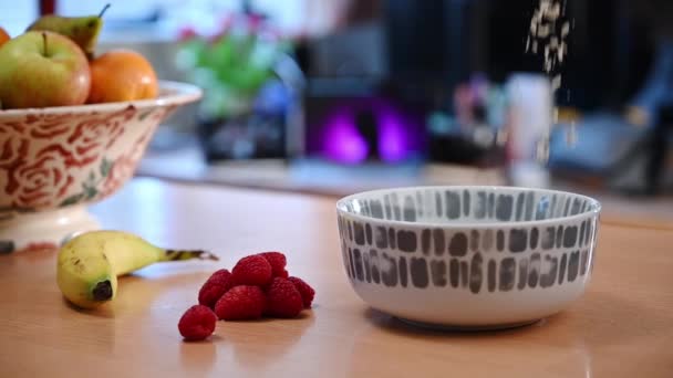 Slow Motion Shot Porridge Oats Being Poured Breakfast Bowl Fruit — Stock Video